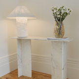 Off-white paper table lamp with wide conical shade and cylindrical base
