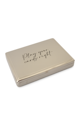 Closed polished gold card case with “Play your cards right” etched on the lid