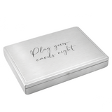 Closed brushed silver playing card case engraved with “Play your cards right” on a white background.