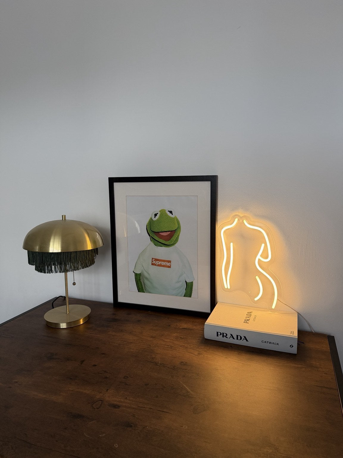 The Body LED neon sign by BAG&BONES illuminated in a styled interior