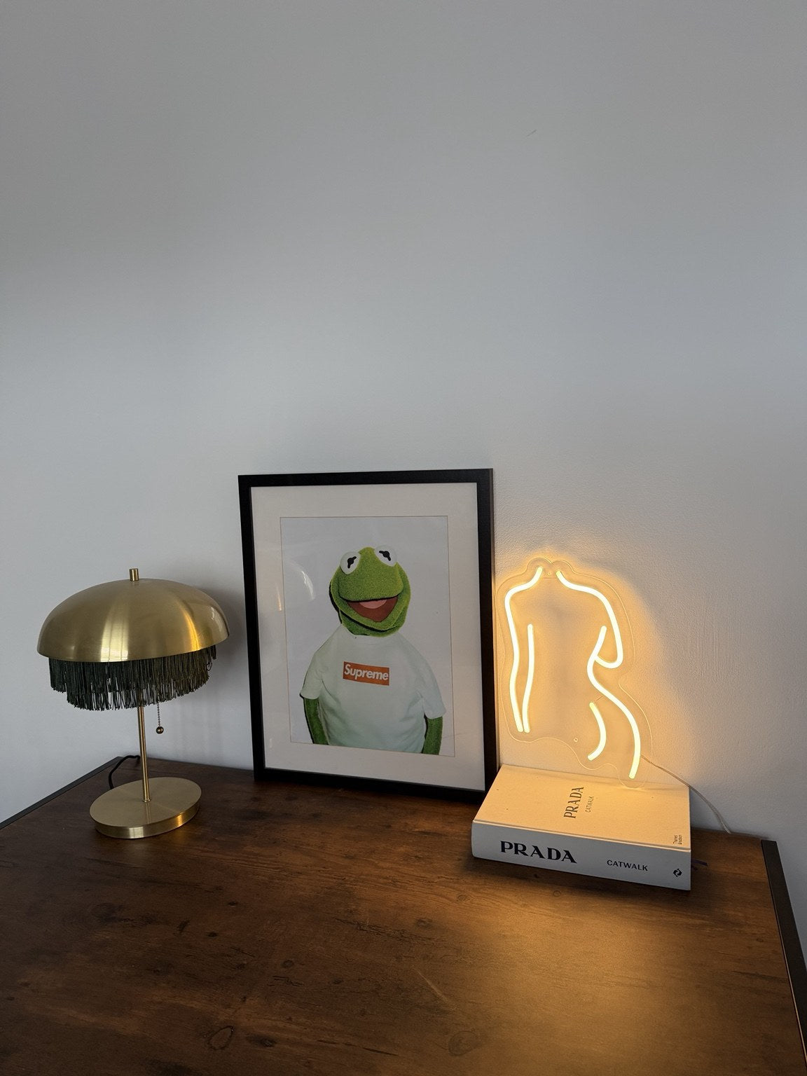 The Body LED neon sign by BAG&BONES illuminated in a styled interior