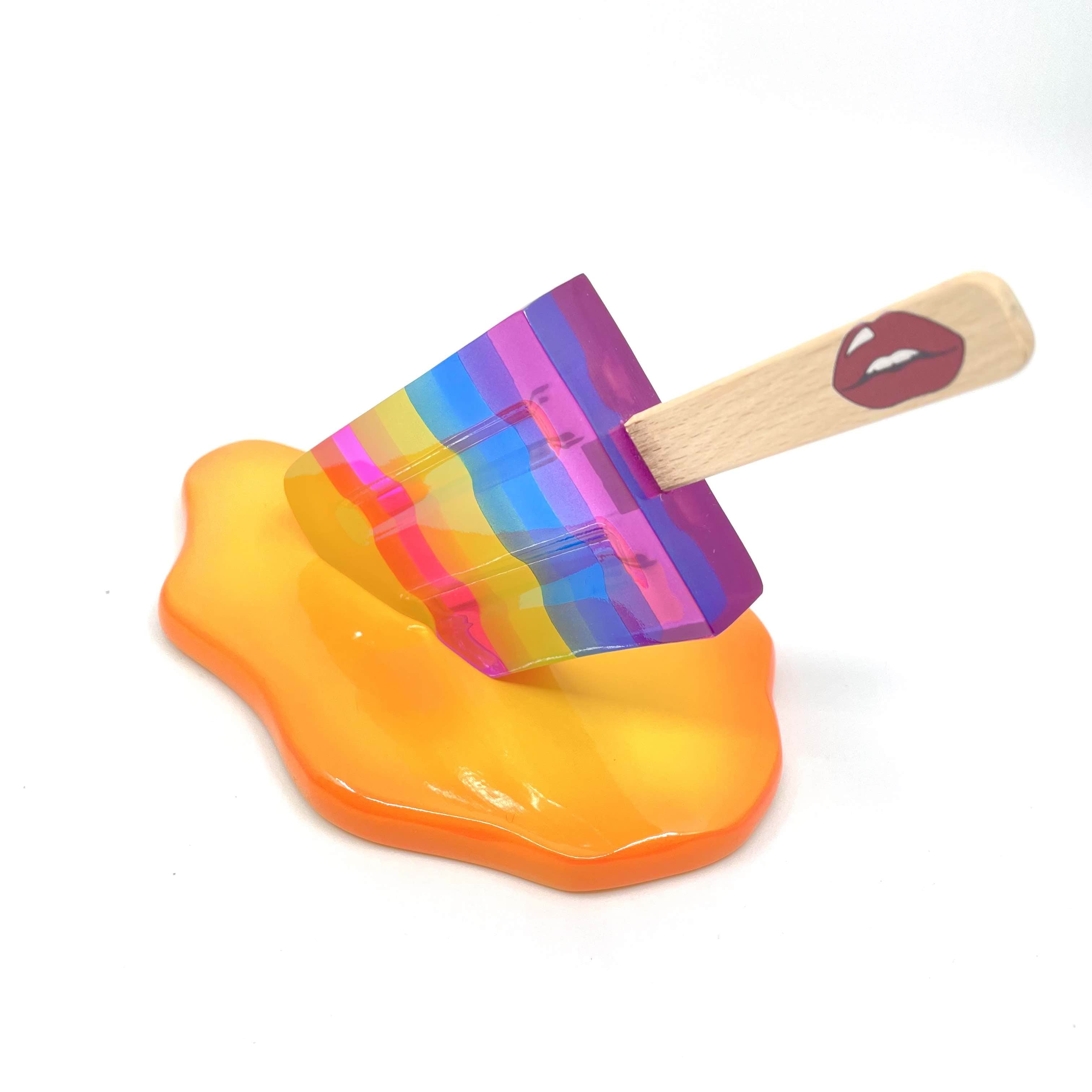 Handmade rainbow ice lolly sculpture with orange puddle base by Bag & Bones