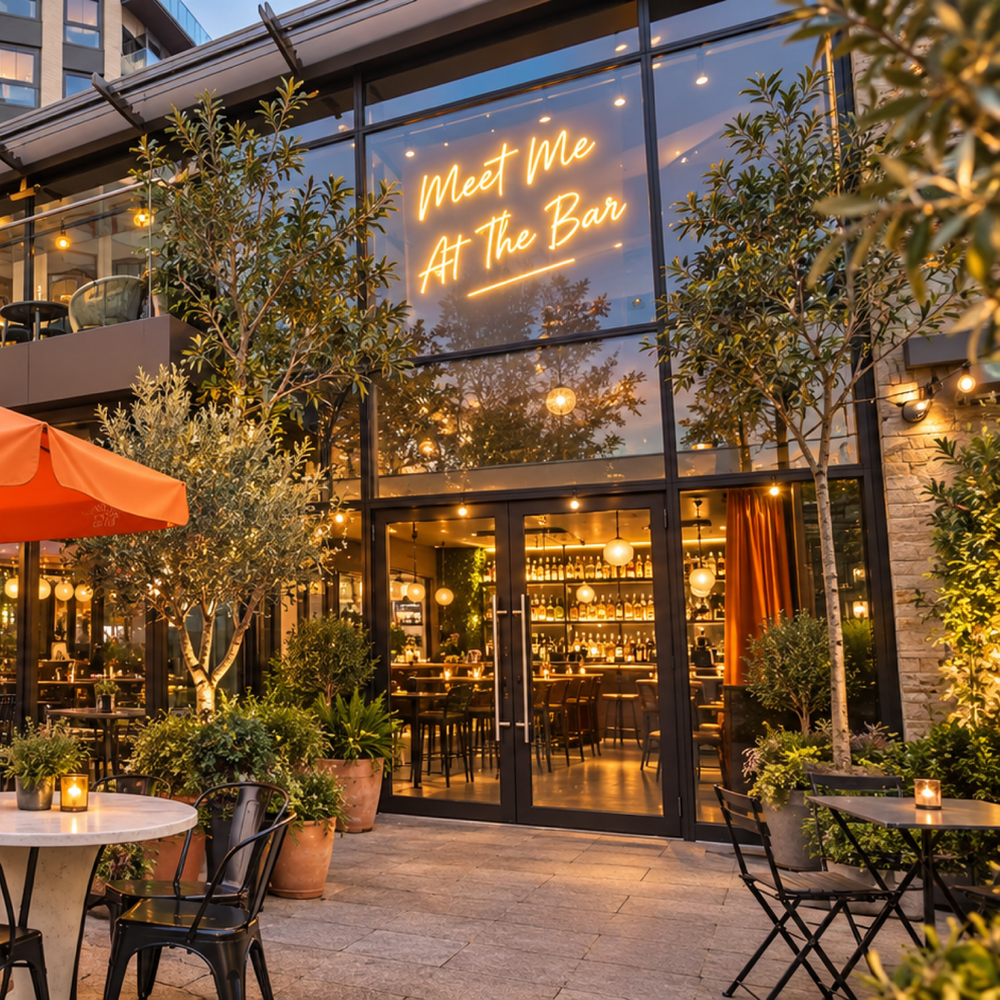 Outdoor bar terrace with illuminated neon signage