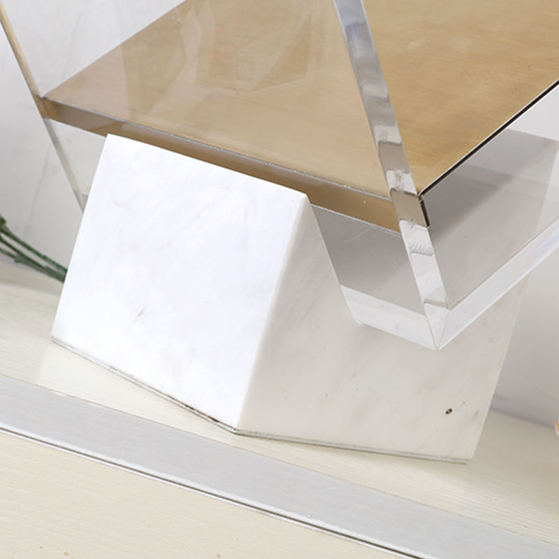 Close-up of the white marble base supporting the Folio magazine holder by BAG&BONES.