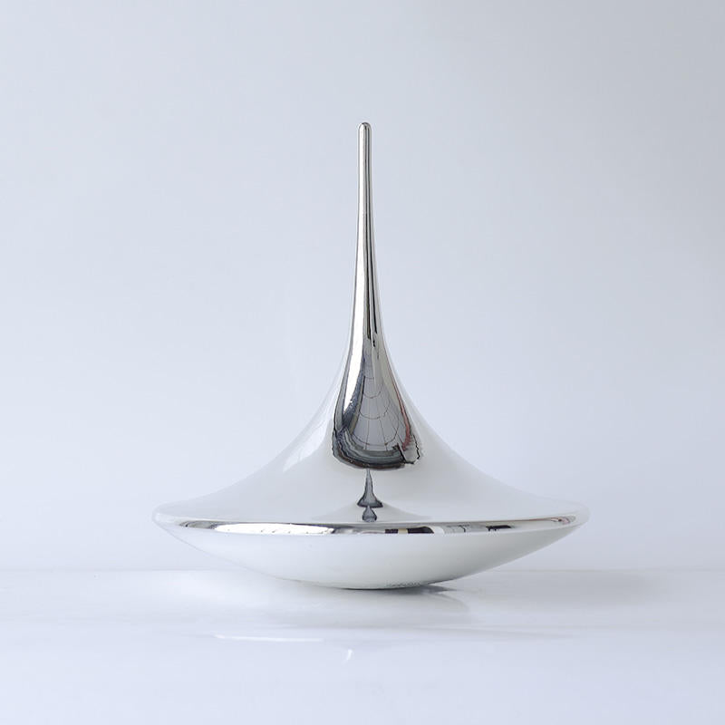 Teardrop sculptural object by BAG&BONES featuring a polished stainless steel finish and flowing contemporary silhouette.