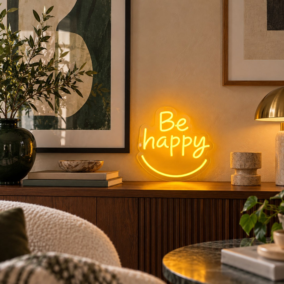 Be Happy LED neon sign by BAG&BONES illuminated in a styled interior