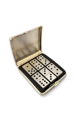 Open gold domino case showing metal domino tiles neatly arranged inside a compact travel set