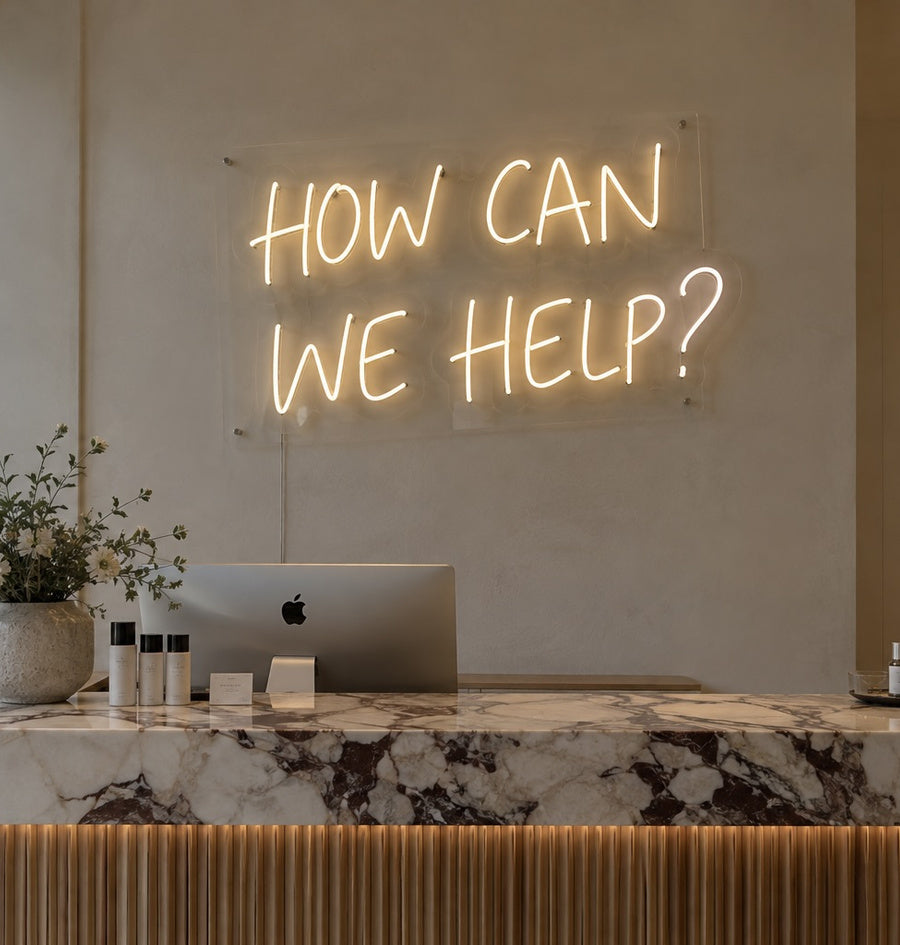 Bespoke neon positioned above a customer service counter