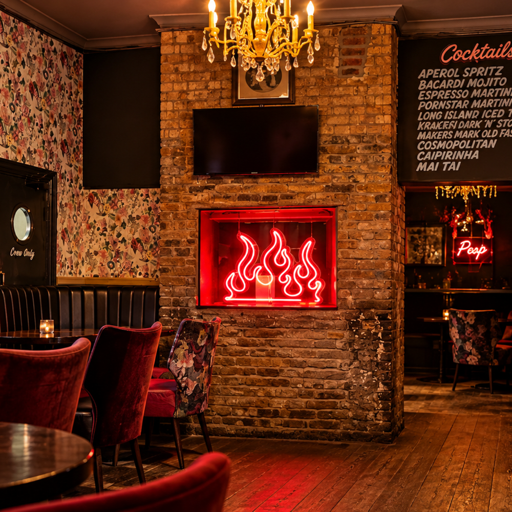 Red neon fireplace feature in a cocktail bar interior