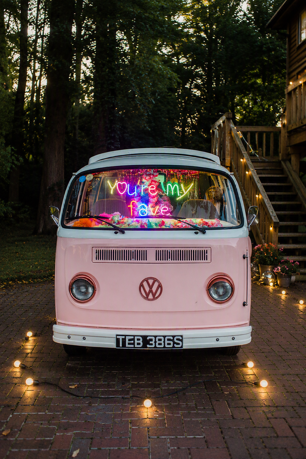 Multicolour “You’re My Fave” wedding neon sign displayed inside a pink campervan by BAG&BONES.