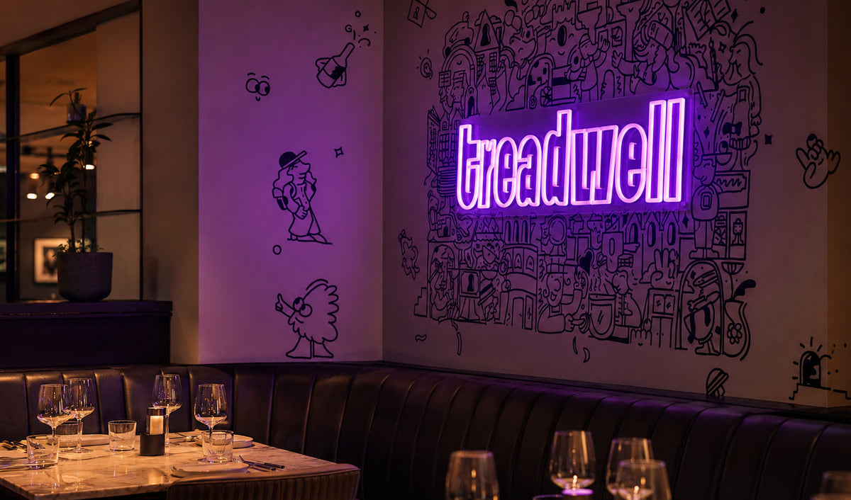 Purple Treadwell neon sign inside The Store Oxford restaurant